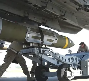 Military aircraft overhead view with ordnance